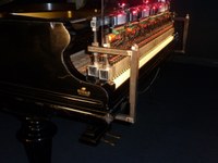Rhea mounted at the grand piano